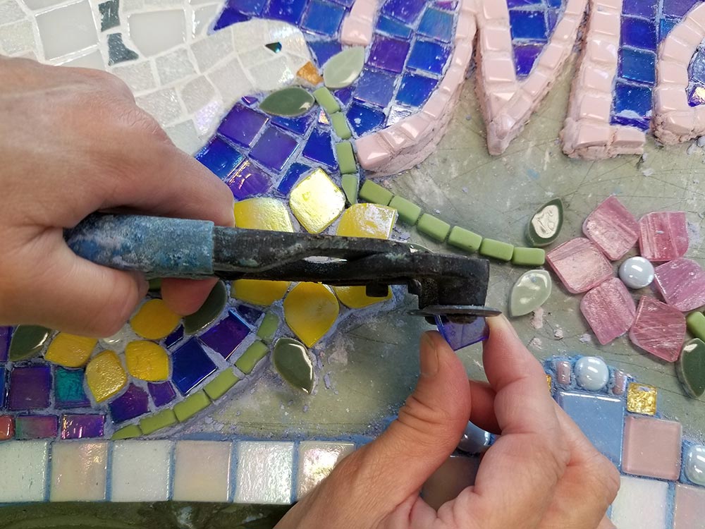 Intricate process of creating a mosaic memorial bench by artist Linda Solby at Water's End Studio